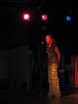 Julie sings a song to motiviate the dancers
